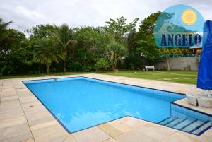 Casa com piscina para venda no bairro Oásis em Peruíbe, entre 800 e 1200 metros da praia